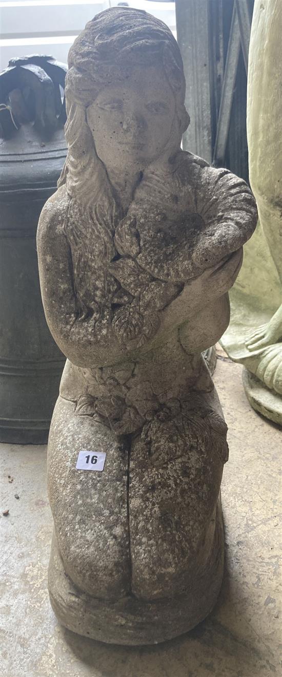 A reconstituted stone garden ornament of a kneeling girl, height 63cm